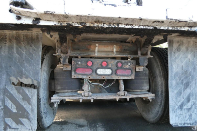 Mack CV Granite dump truck rear undercarriage showing rear suspension and bumper lights