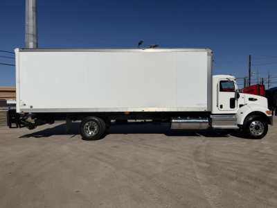 Peterbilt 337 box truck side view showing cargo box and cab with white exterior.