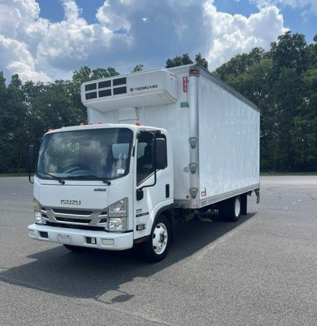 Isuzu box truck with a refrigerated cooler on top of cab showing Isuzu logo on grille and front; white exterior; refrigeration unit on top front of box.
