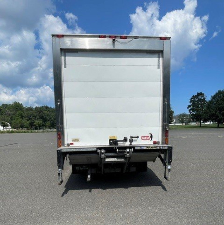Isuzu NQR box van truck rear view showing tailgate and bumper.