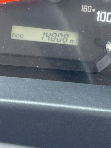 Dashboard odometer reading 149,008 miles visible in the gauge cluster of a 2022 Isuzu NQR box van truck.