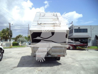 Isuzu NPR XD 2021 truck chassis rear view showing chipping bed and tailgate.