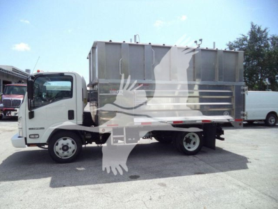 Isuzu NPR XD truck in profile view with large dump bed, white cab, and silver dump body.