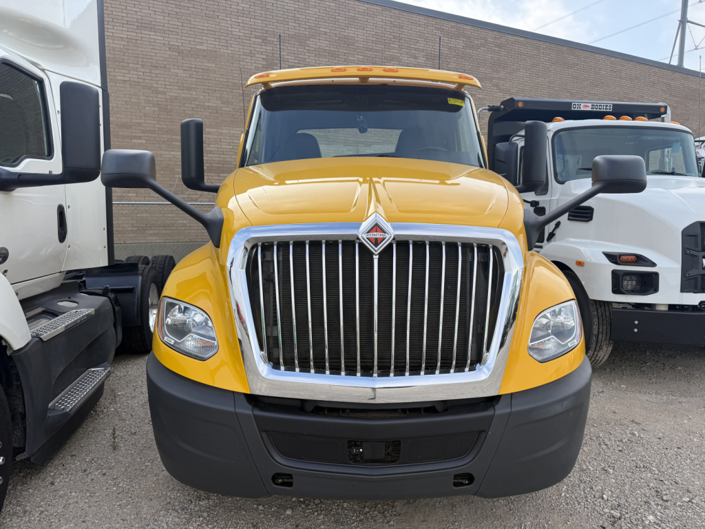Yellow 2019 International LT Conventional Daycab truck front view showing chrome grille, large bumper, and headlights.