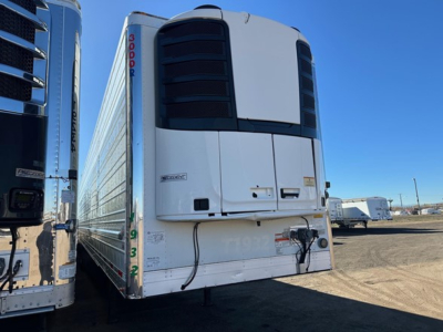 Rear view of a white Utility 3000R refrigerated trailer with large black cooling unit at the front, vertical red '3000R' lettering on the left edge, and a lower rear door area with a small step and equipment mounting.