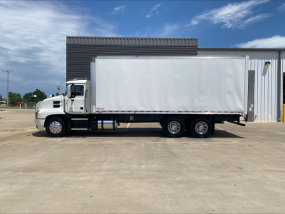 Box truck side view showing cargo area and Mack AN64 model trailer with white box and dual rear axles.