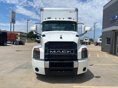 Front view of white 2019 Mack AN64 box truck showing Mack grille and bumper.