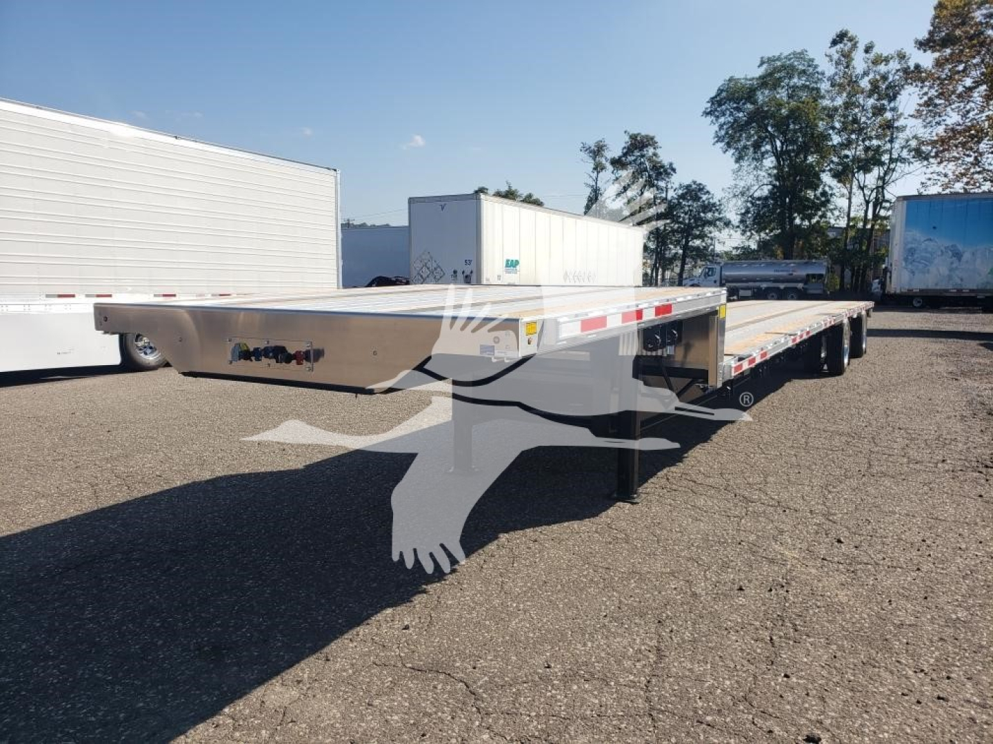 Wabash Combo Low Pro 17.5 dual/long trailer showing aluminum deck and rear ramps.