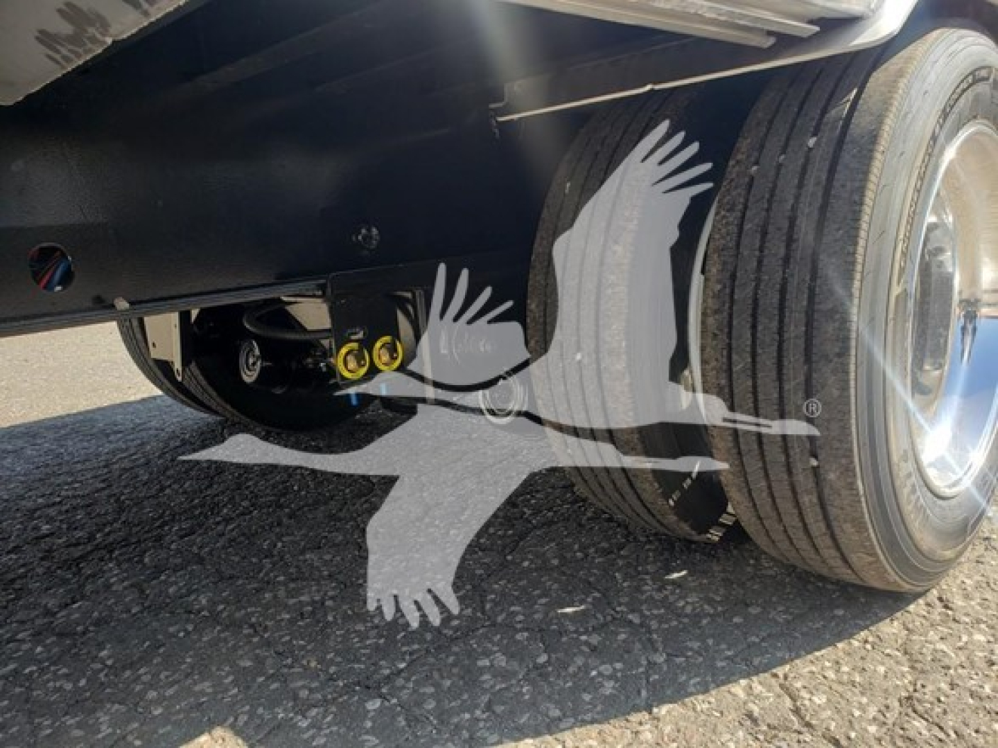 Trailer undercarriage showing dual rear wheels and suspension components on a 2024 Wabash Combo Low Pro 17.5 trailer.