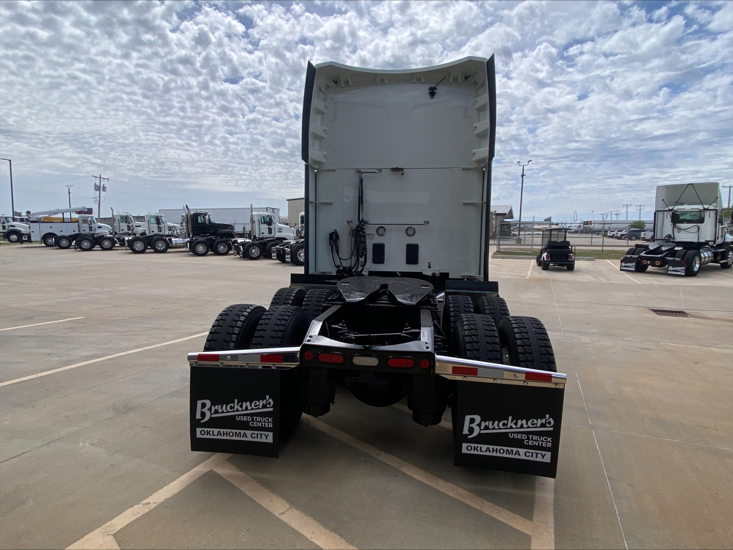 Peterbilt 579 rear view showing fifth wheel, mud flaps with Bruckner’s Oklahoma City branding, and rear tires; no engine details visible.