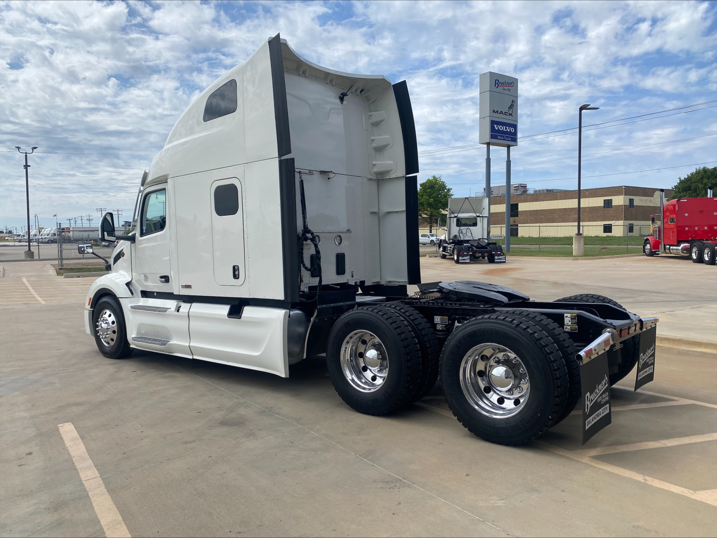 Peterbilt 579 tractor, sleeper cab, side view showing rear axles and chassis.