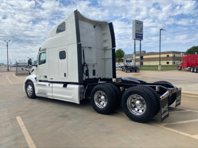 Peterbilt 579 tractor, sleeper cab, side view showing rear axles and chassis.
