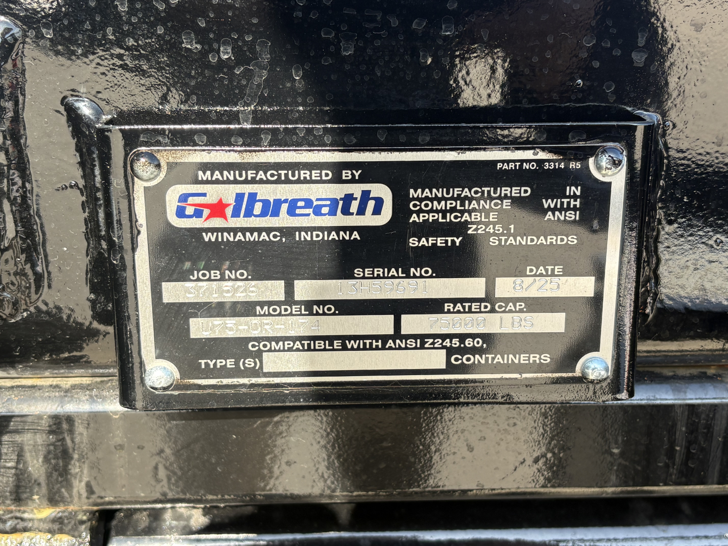 Manufactured by Galbreath plate on black equipment showing model, serial number, date and safety standards.