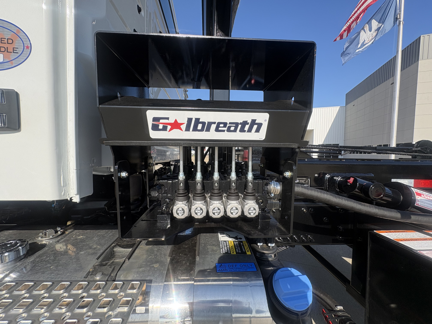 Volvo VHD64B300 roll-off truck component with Abreath logo on hydraulic manifold and hoses visible