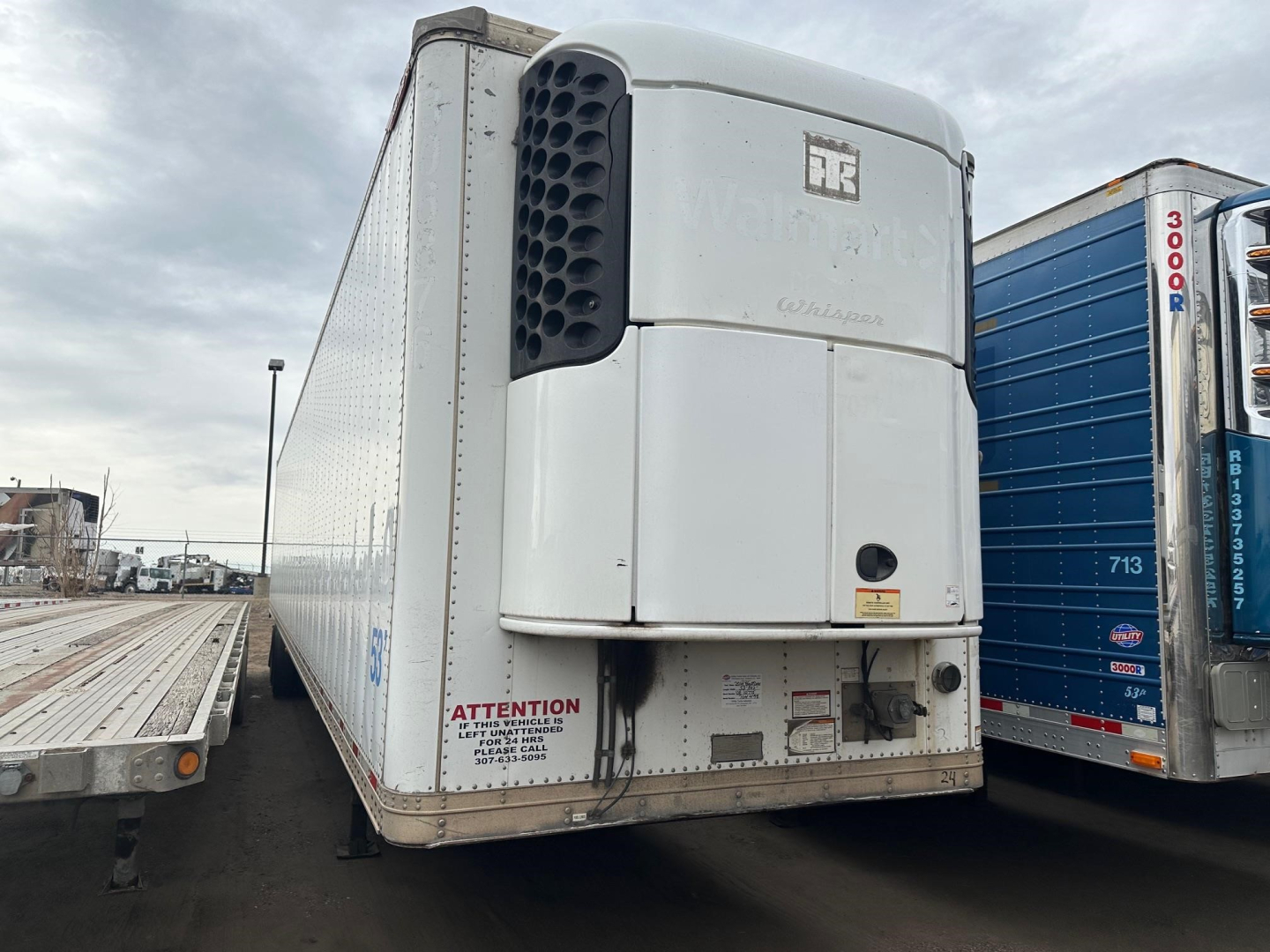 Reefer trailer rear view showing carrier unit and branding, Great Dane rolling door multi temp refrigeration trailer, VIN 150114098700 on rear door area.