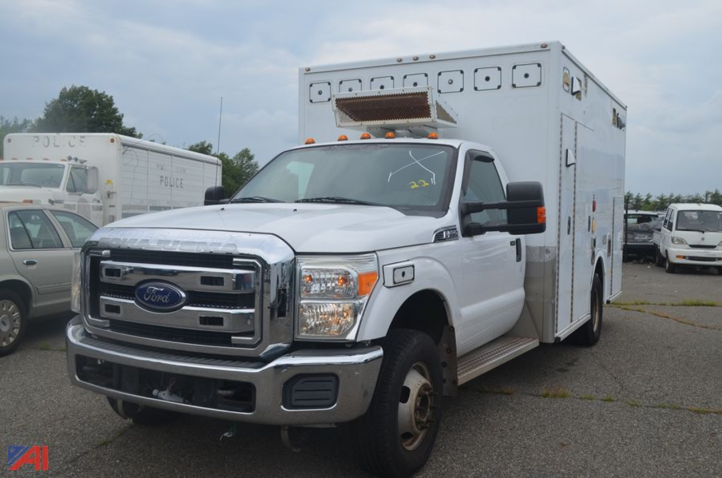 Ford F-350 Super Duty ambulance front-left view with large patient care module on chassis.