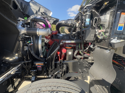 Mack PI64T engine bay showing fuel system and turbocharger components with labeled hoses and wiring harnesses.