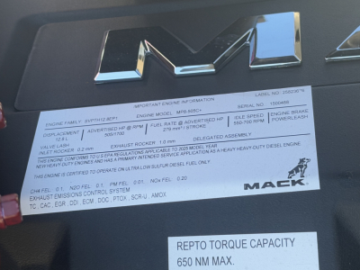 Mack PI64T engine bay label showing important engine information and Mack logo.