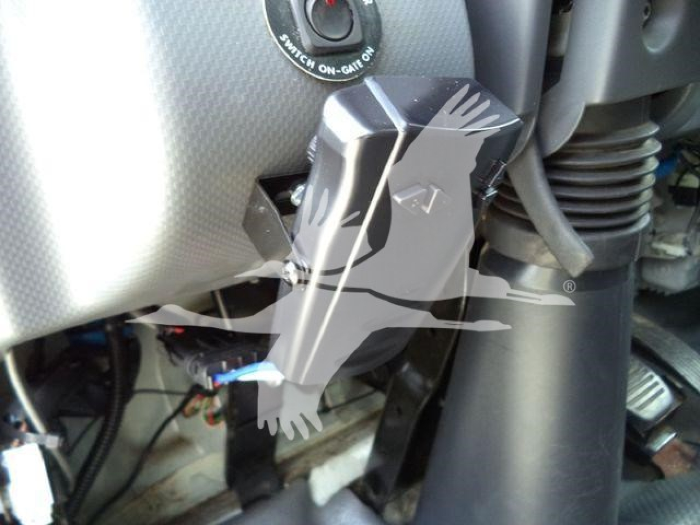 Isuzu NPR-HD instrument area with key turn switch and nearby wiring; close-up shows internal cabling and control stalks.
