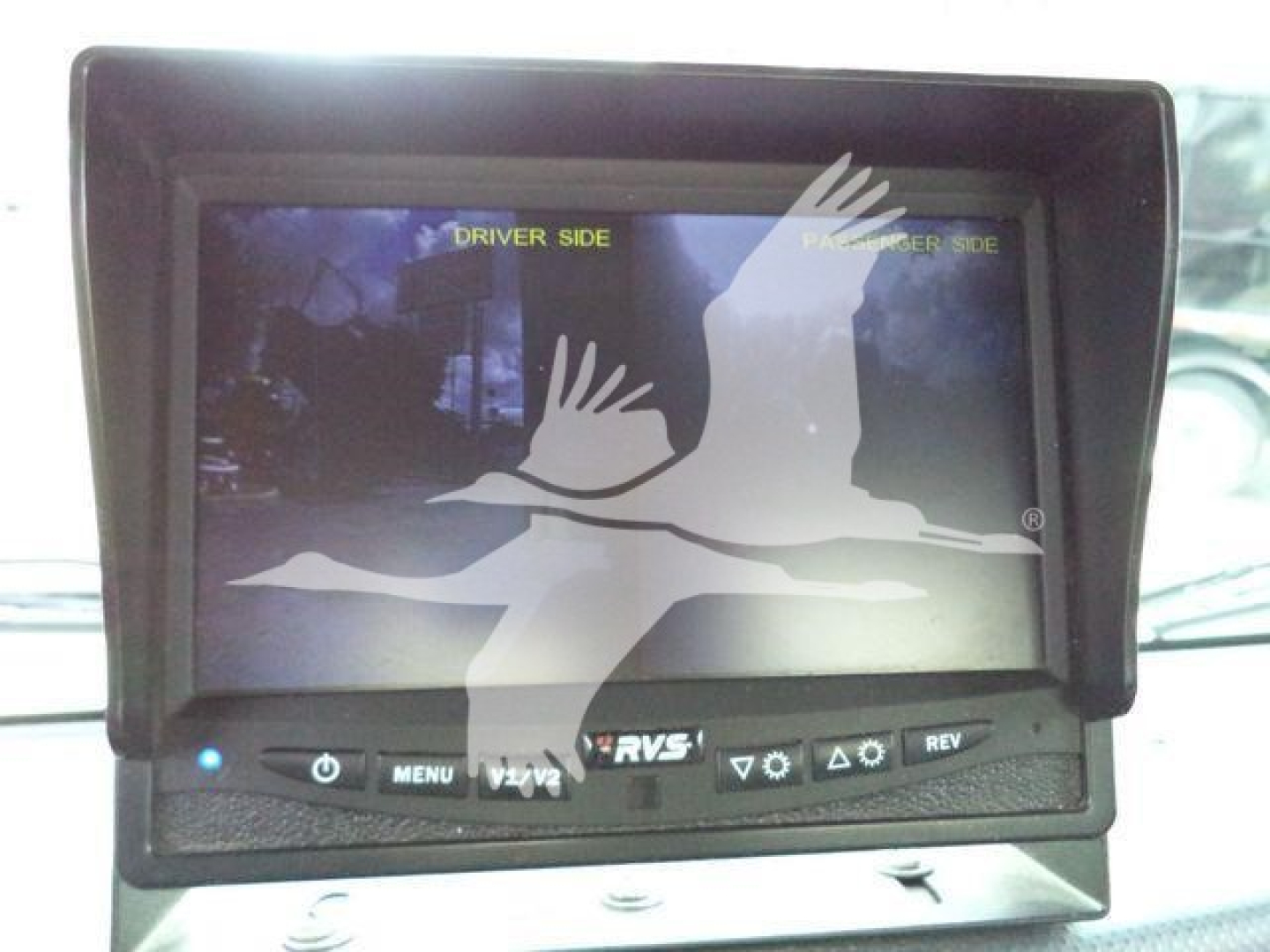 In-vehicle monitor/display on Isuzu NPR HD cab showing driver and passenger side indicators