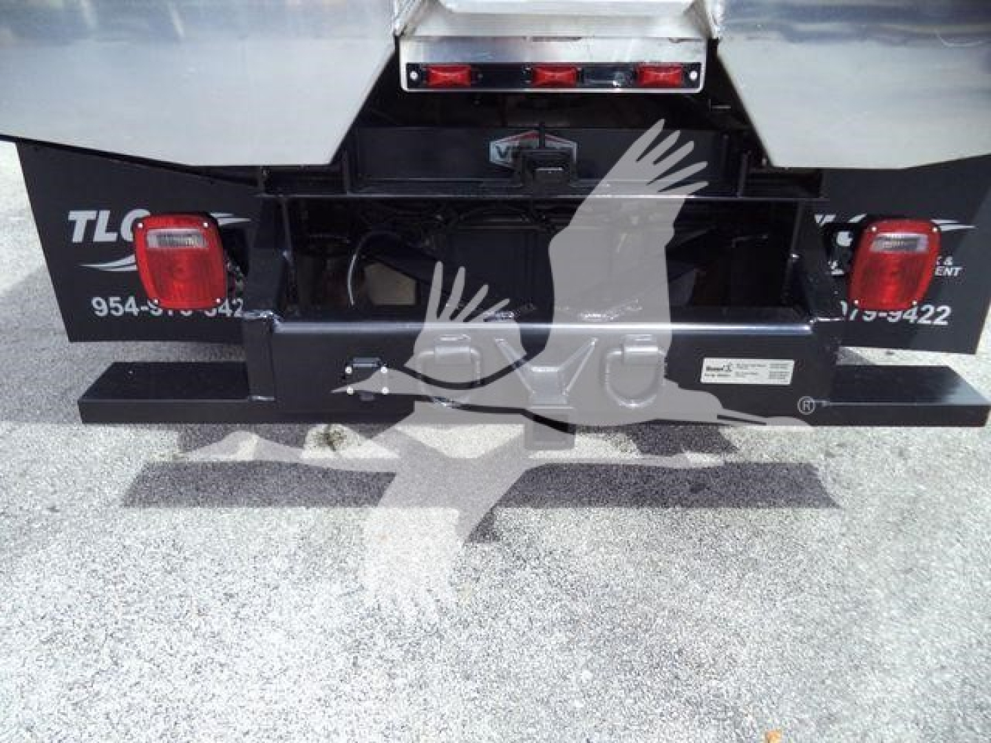Isuzu NPR HD rear view showing hitch area and bumper with taillights