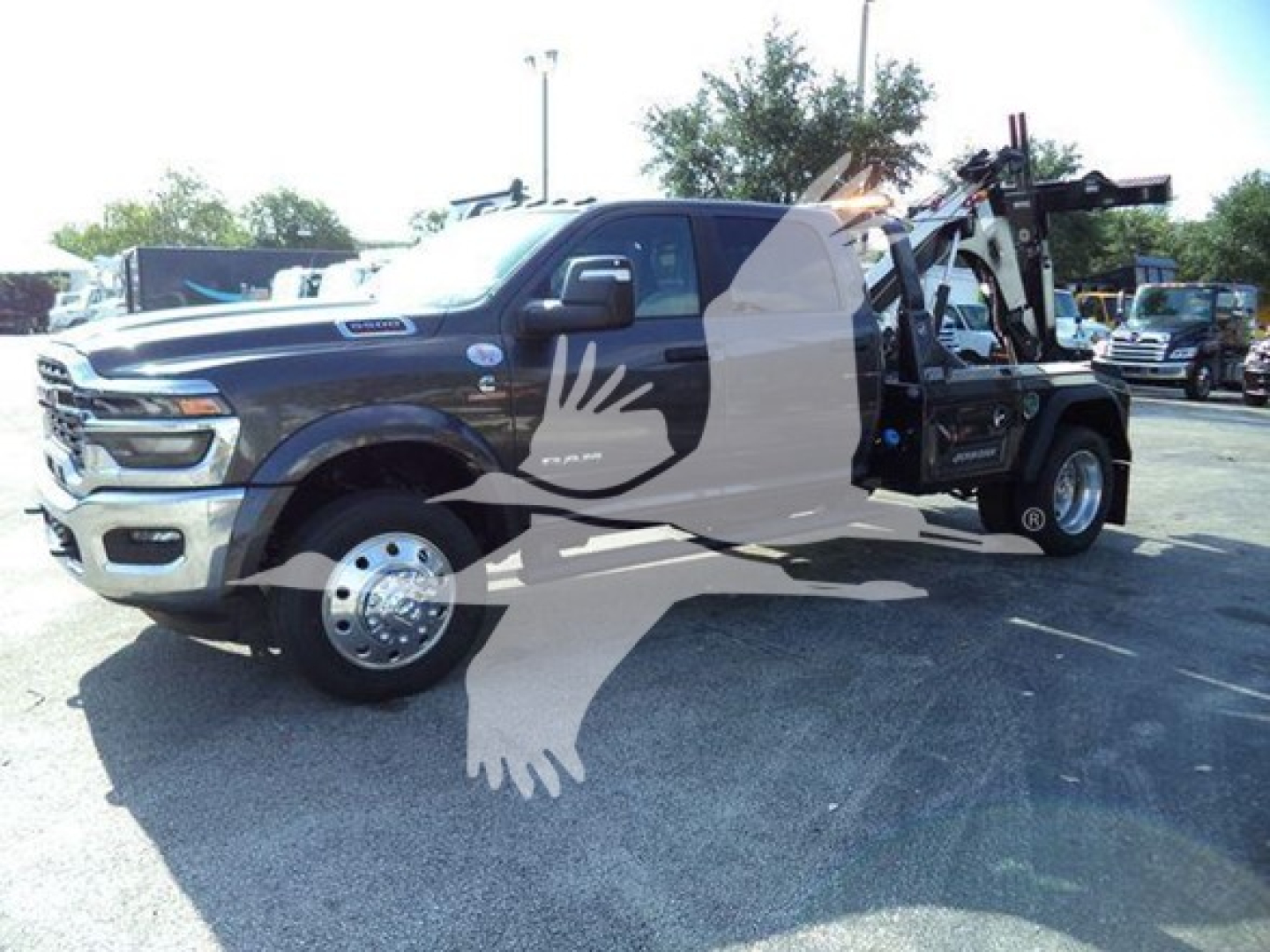 Ram 2500 tow truck in bay showing winch platform and dual rear wheels