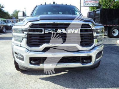 Ram truck front view showing chrome grille and large RAM emblem badge with winch category vehicle badge visible.