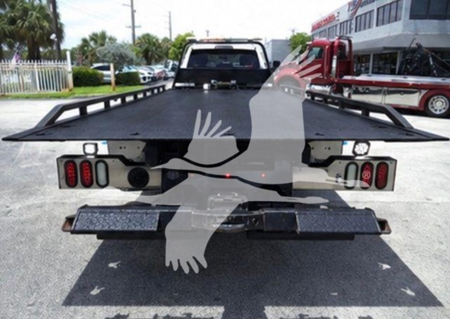 Ram 2021 Slt rollback truck rear with flatbed and taillights, visible VIN plate area, stock number T25888.