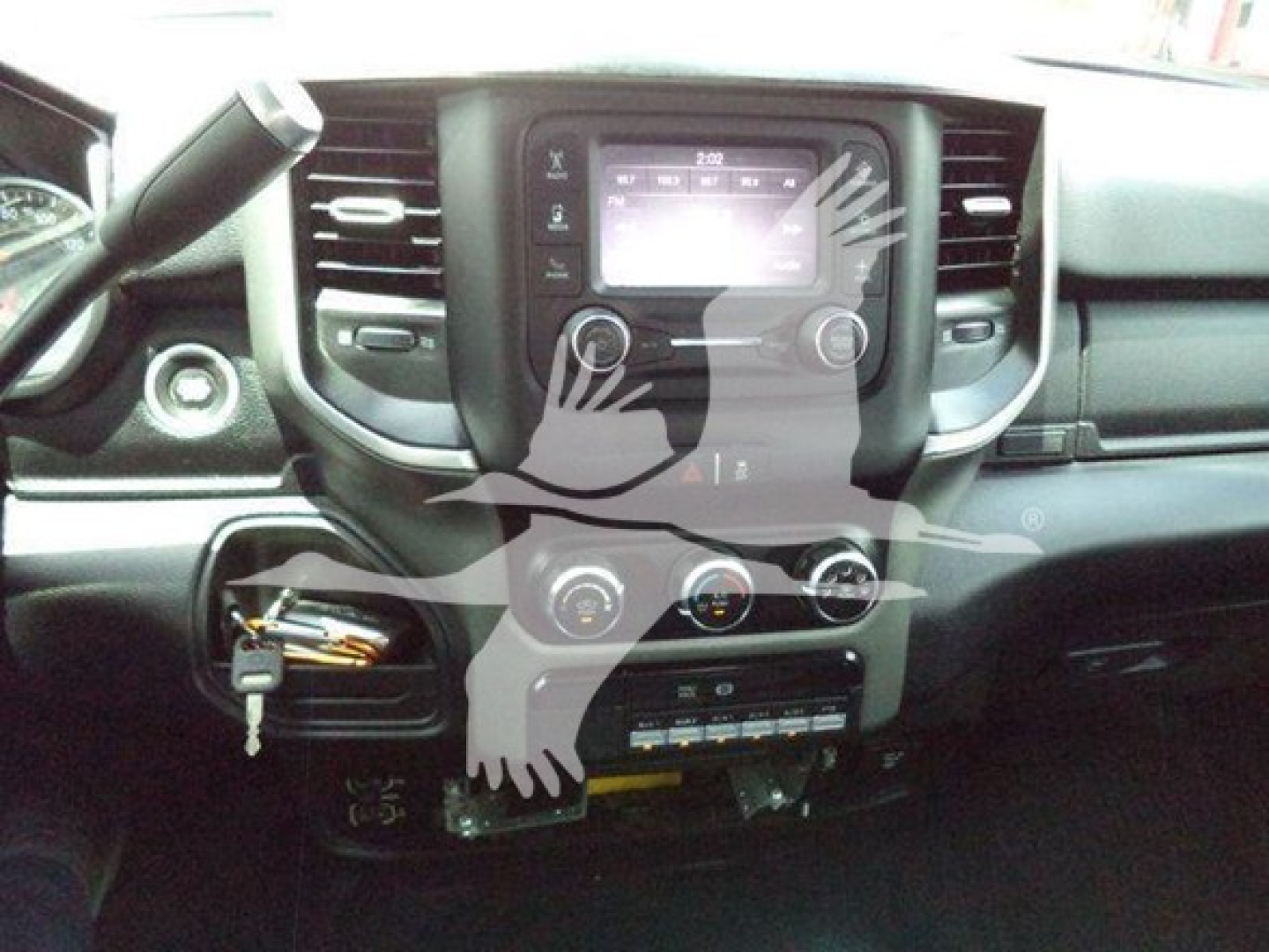 Ram pickup interior showing center touchscreen head unit and climate controls
