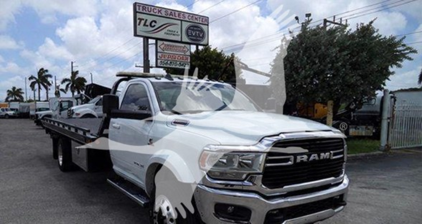 Ram tow truck on flatbed with RAM grille, white cab, and rollback equipment; TLC Truck Sales background sign; VIN 3C7WRMDL6MG625888 visible; stock T25888.