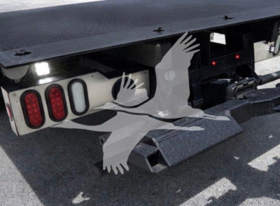Ram pickup truck rear view showing tailgate and hitch area; includes taillights and bumper assembly visible.
