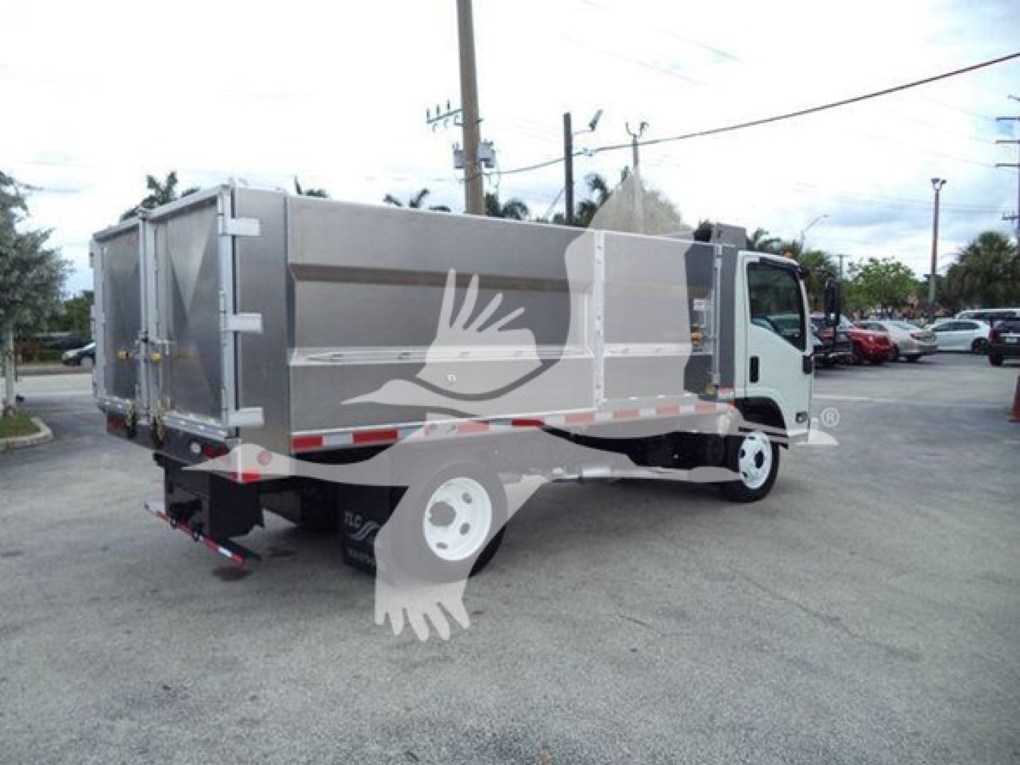 Dump truck 2017 Chevrolet W4500 side/rear view showing cargo bed and cab with stock number T05871.