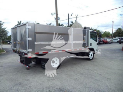 Dump truck 2017 Chevrolet W4500 side/rear view showing cargo bed and cab with stock number T05871.