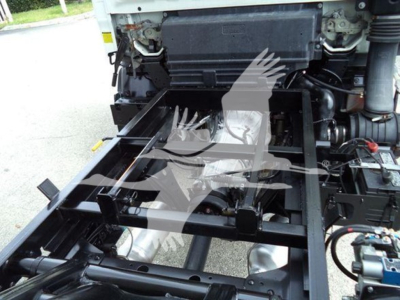 Truck chassis frame showing front engine area and mounting frame for cargo bed on a 2017 Chevrolet W4500.