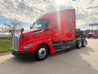 Kenworth T680 tractor-trailer in red, side view showing aerodynamic hood, sleeper cab, dual rear axles, chrome grille and wheels.