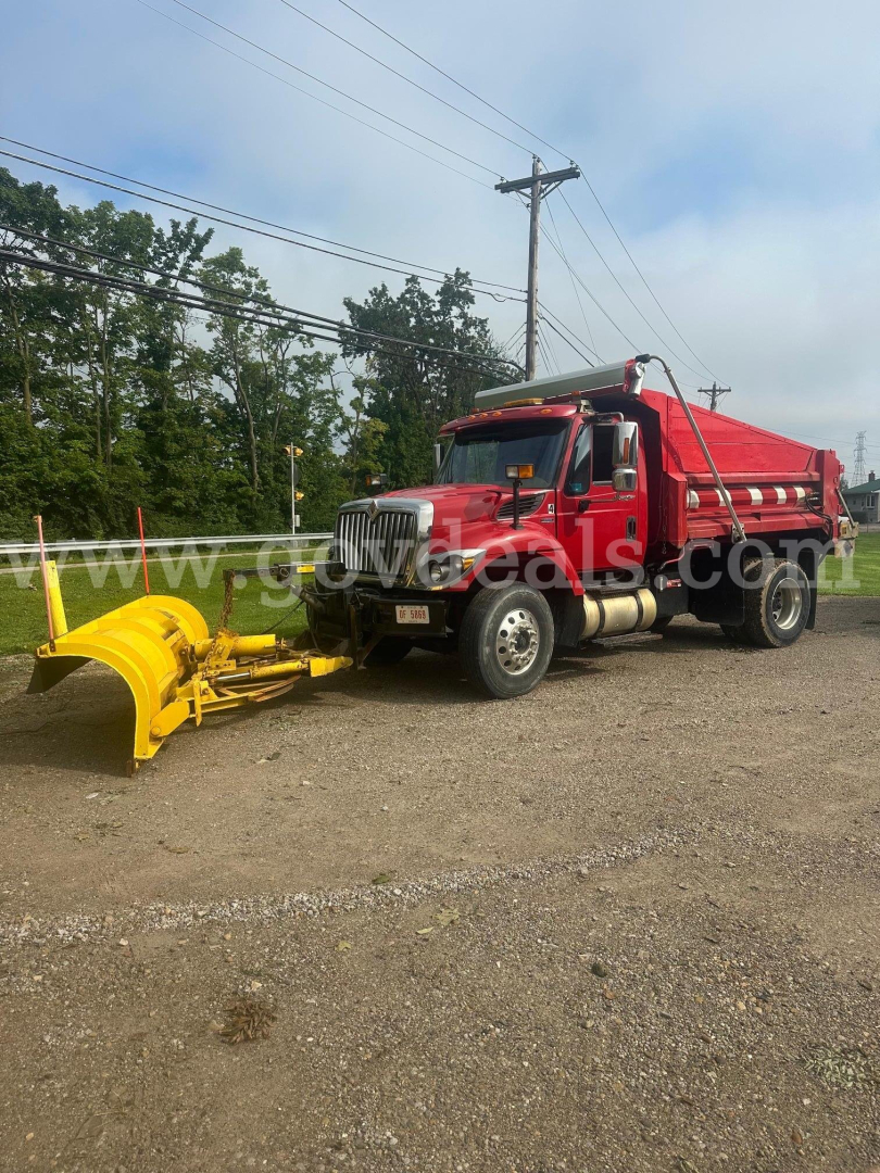 Truck-mounted plow setup on a red 2008 International 7400 with yellow plow attachment.