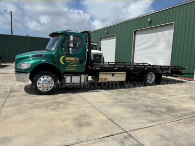 Tow truck 2017 Freightliner M2 106 side view with flatbed, green cab, stock number 22783-201, VIN 1FVACWDT1HHHV4869 visible on listing image.