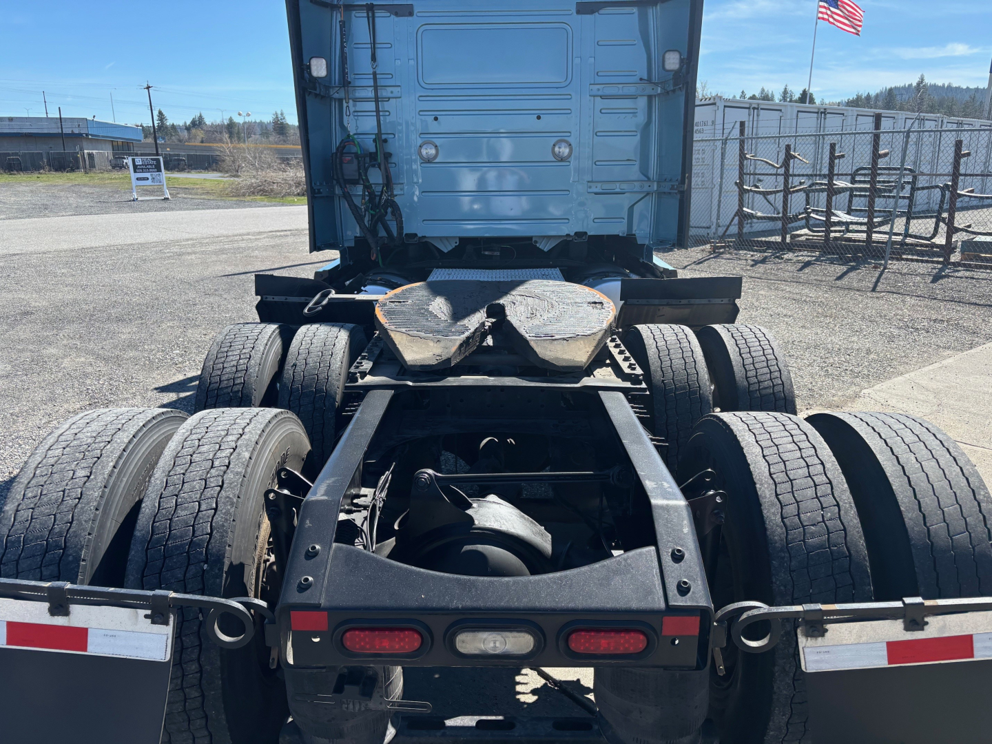 Volvo VNR64T660 truck chassis rear view showing dual rear axles and fifth wheel area.