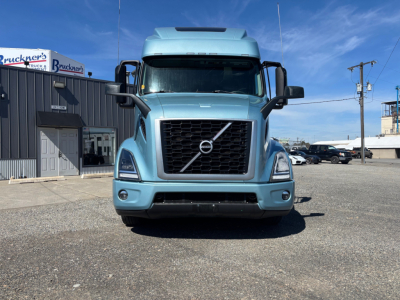 Volvo VNR64T660 heavy-duty truck front view in light blue with prominent grille and Volvo emblem.
