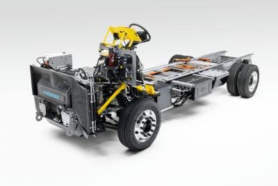Harbinger S554 chassis only showing steering wheel and exposed frame with front cab assembly, drivetrain skeleton, and rear dual axles.