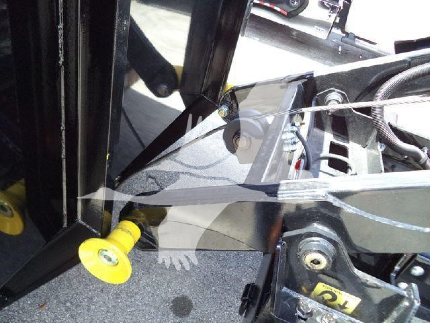 Isuzu NPRR truck component view showing hydraulic lift/ram and mounting hardware with yellow handle knob.