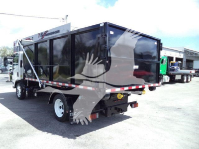 Truck bed with roll-off container attached to Isuzu NRR chassis, rear view showing black container, white wheels, and reflective stripes.