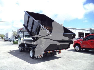 Isuzu NPR/NRR truck with a raised dump bed, side view showing cargo box and rear of truck.
