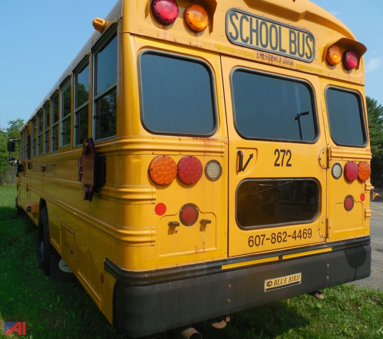 Rear view of a yellow 2019 Blue Bird Vision school bus showing tail lights and school bus sign.