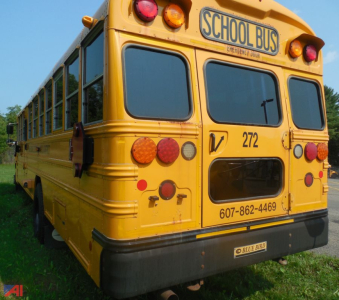 Rear view of a yellow 2019 Blue Bird Vision school bus showing tail lights and school bus sign.