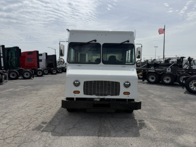 Front view of a white Harbinger S554 step van with large grille, headlights, and bumper; no visible branding text.