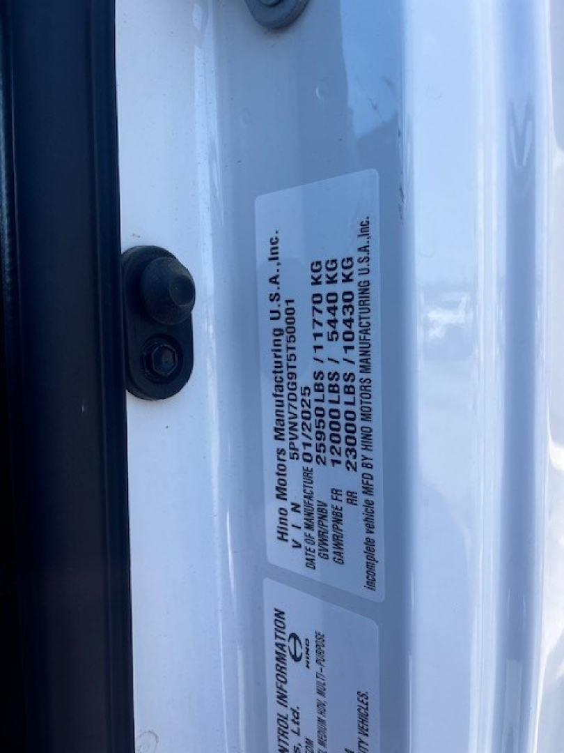 Label on Hino L7 door jamb showing vehicle data: VIN, Gross Vehicle Weight, and axle weights.