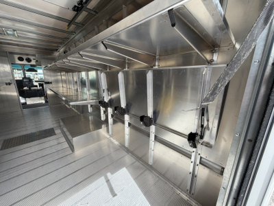 Harbinger S534 step van interior showing aluminum framework and vertical support rails along cargo area.