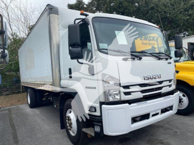 Isuzu box truck cab front-left view showing cab and cargo box, with Isuzu badge on grille and side mirrors.
