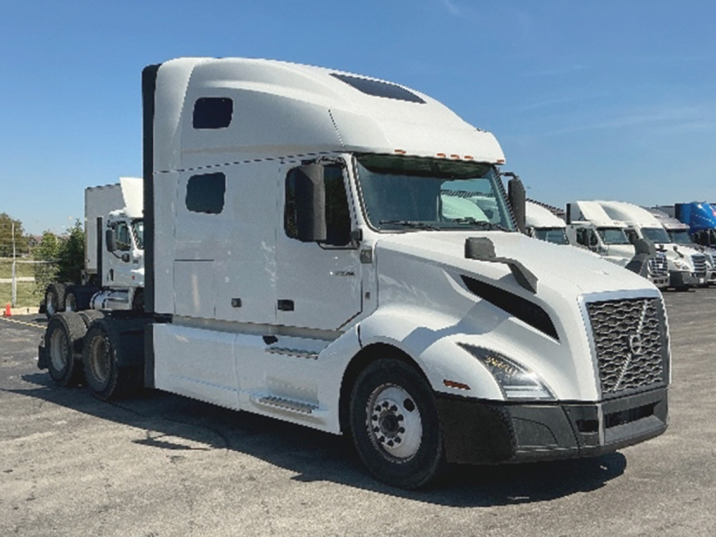Volvo VNL 760 tractor cab in-service showing aerodynamic hood and grille, with sleeper bay and multiple wheels visible.